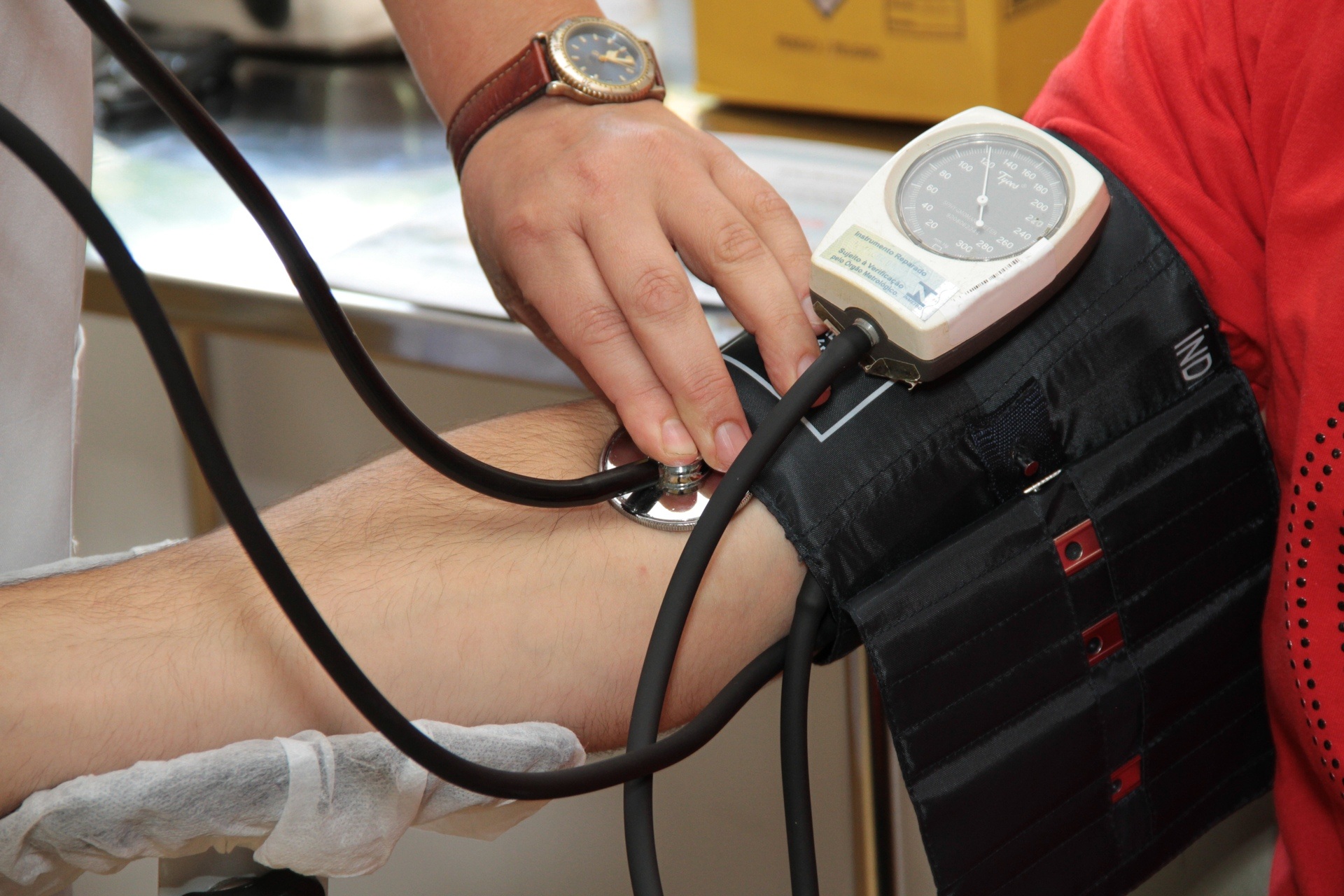 Patient receiving blood pressure test at hospital consultation, infectious disease treatment provided by ID Consultants of Northeast Ohio